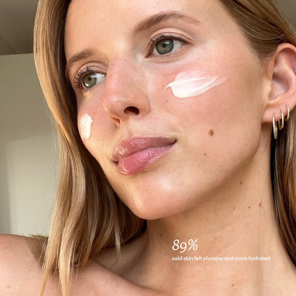 Model with cream o her face demonstrating the texture of the Cocoon Ceramide Cream