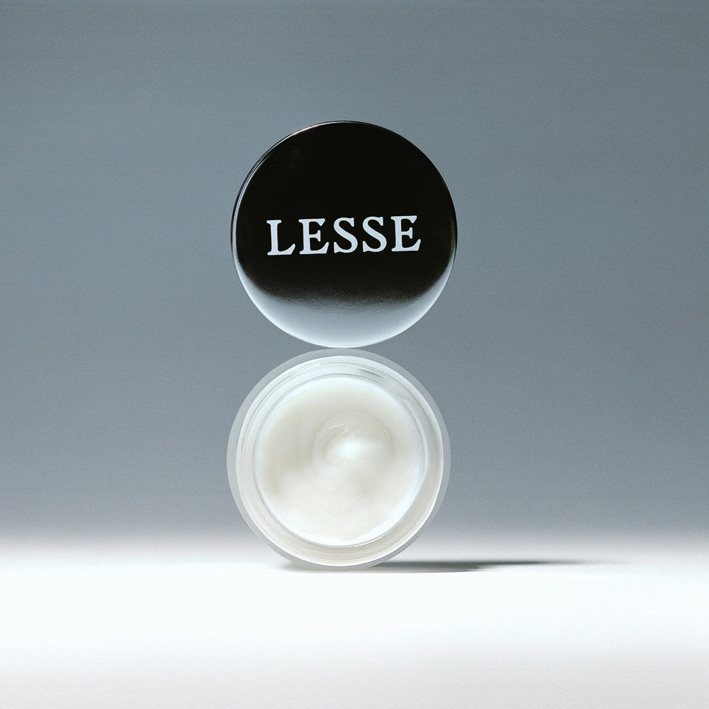 LESSE Awakening Eye Cream Lid Balancing on Jar, Brightening Prickly Pear & Reparative Baobab to brighten, reduce puffiness, firm, and awaken the eyes - Gllosse
